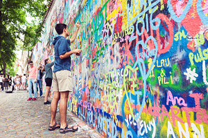Young man painting grafitti wall, an Arts & Entertainment Photo by BOOCYS