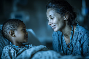 Compassionate nurse comforting young black patient with kindness, a Health & Medical Photo by AS photostudio