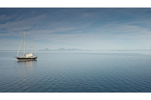 Wooden yacht anchor peacefully on, a Nature Photo by Goinyk