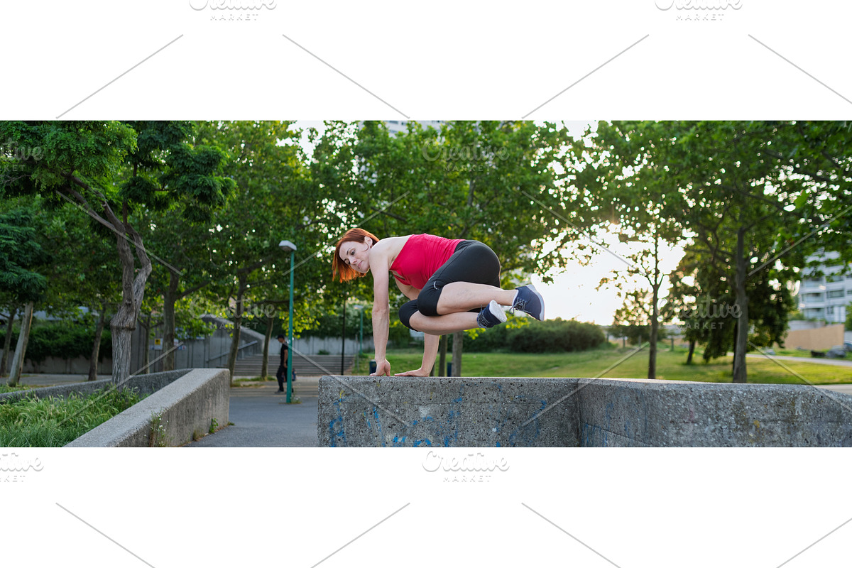 Woman working out in the city, doing, a Graphic by HalfPoint