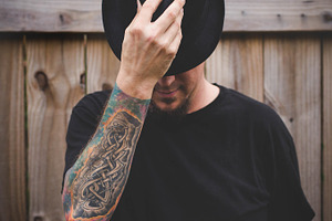 Tattooed Man in Black