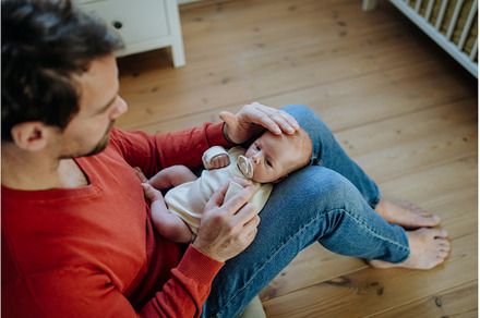 Close-up of father holding his, a Person Photo by HalfPoint