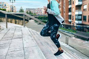 Woman training cardio running up stairs in town, a Sports & Recreation Photo by davidpereiras