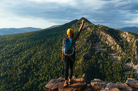 The man on the top of the mountain, a Person Photo by SOTNIKOV_MISHA