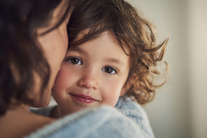 Mother hugs child in warm embrace, a Photo by Beautiful things