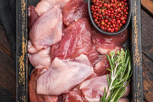 Uncooked, skin-on quail fillets with fresh spices in a rustic bo, a Food & Drink Photo by composter-box@mail.ru