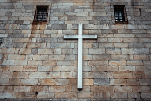 Stone wall with white cross detail, an Architecture Photo by SkyNext