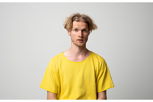 Young man standing with a neutral, a Person Photo by volodymyrshtun13795