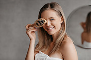Hair care concept. Pretty young lady wrapped in white towel covering eye with h, a Photo by Prostock-Studio (Thumbnail 1 of 3)