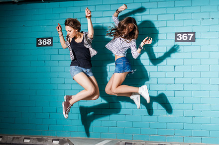 Happy young people having fun and ju stock photo containing bff and adult, an Arts & Entertainment Photo by Mikalai