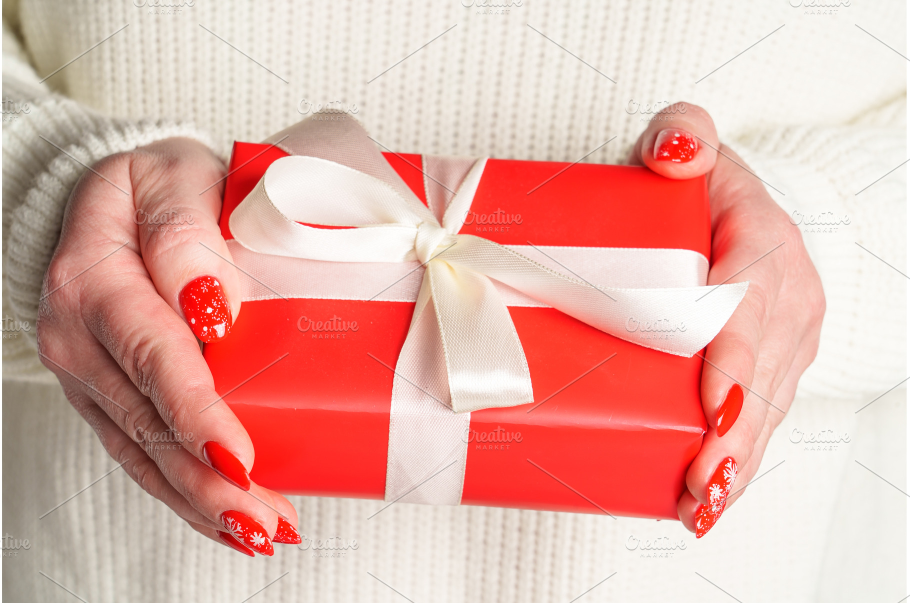 Woman giving christmas gift box for, a Holiday Photo by Nadia-nb