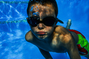 Child diving containing child, diving, and swimming