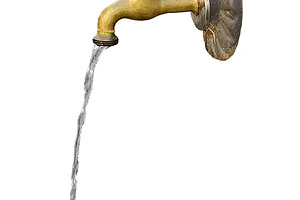 Isolated image of a stream of water falling from an old faucet, an Industrial Photo by DanFLCreativo