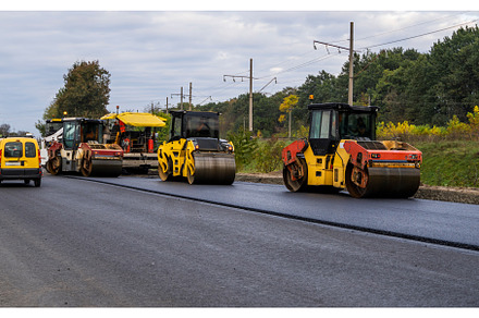 Heavy Asphalt Road Roller with Heavy, an Industrial Photo by volodymyrshtun13795