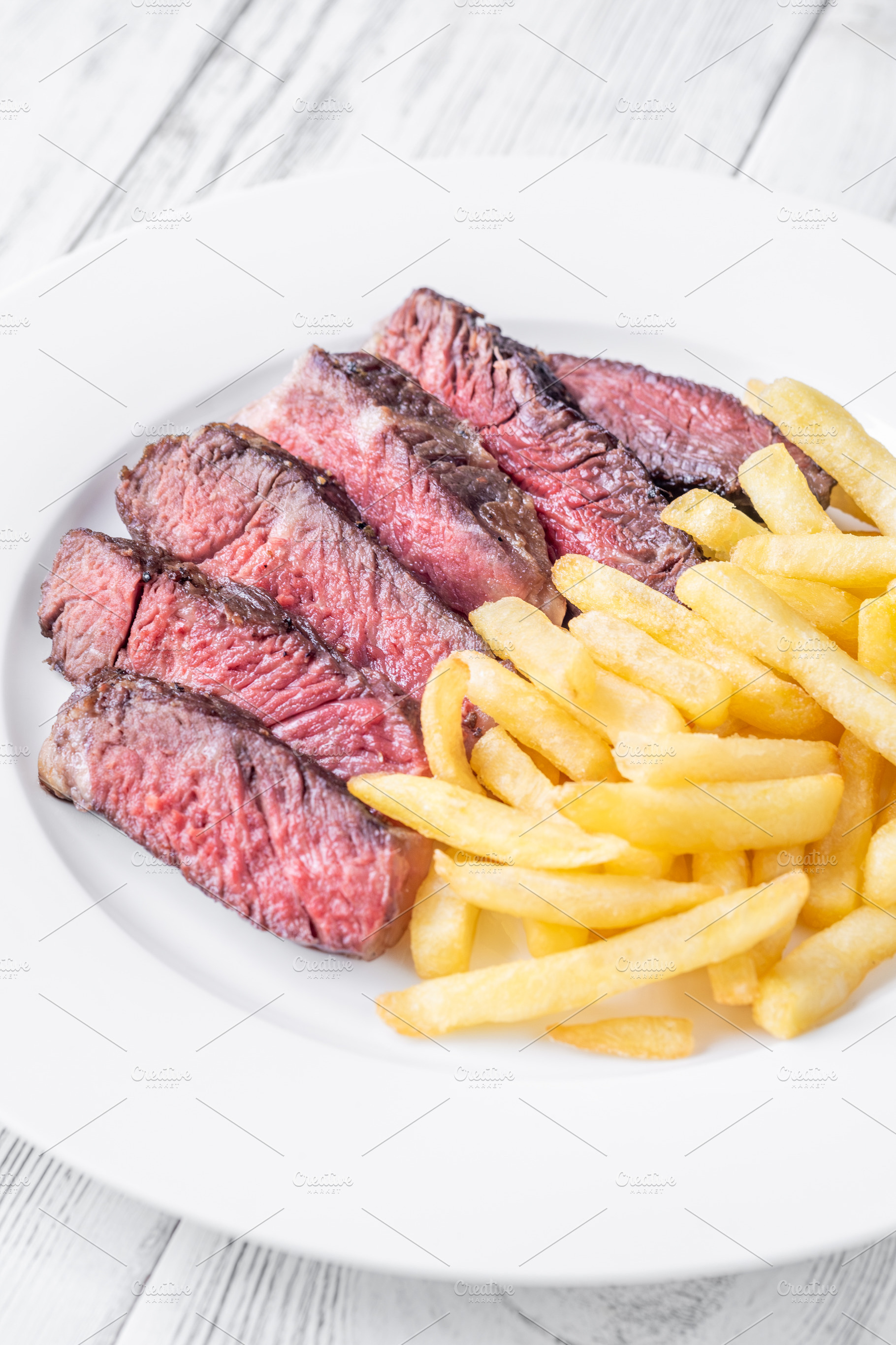 Sliced Medium-Rare Ribeye Steak, a Food & Drink Photo by Alexander Prokopenko