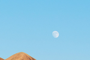 the Moon over the hills