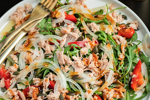 Fresh Tuna Salad with Onions and Cherry Tomatoes. Italian Mediterranean Cuisine, a Food & Drink Photo by Budarinphoto