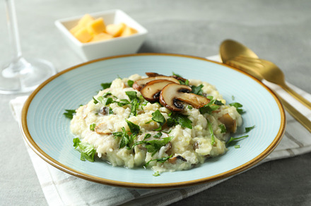 Concept of tasty food with risotto with mushrooms, close up, a Background Photo by AtlasStudio PRO