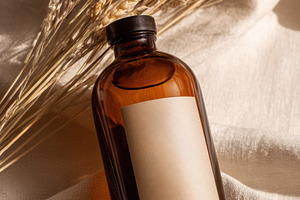 Dried wheat bouquet in amber bottle, a Beauty & Fashion Photo by Virgo Studio