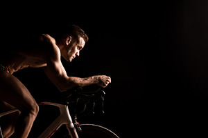 Man on bicycle preparing for triathl