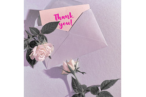 Open envelope with a pink thank you, a Photo by tilialucida