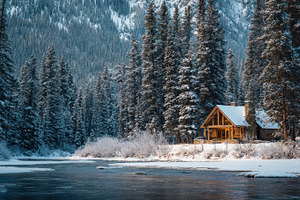 Wooden cabin surrounded by snow, a Photo by Pavel_design