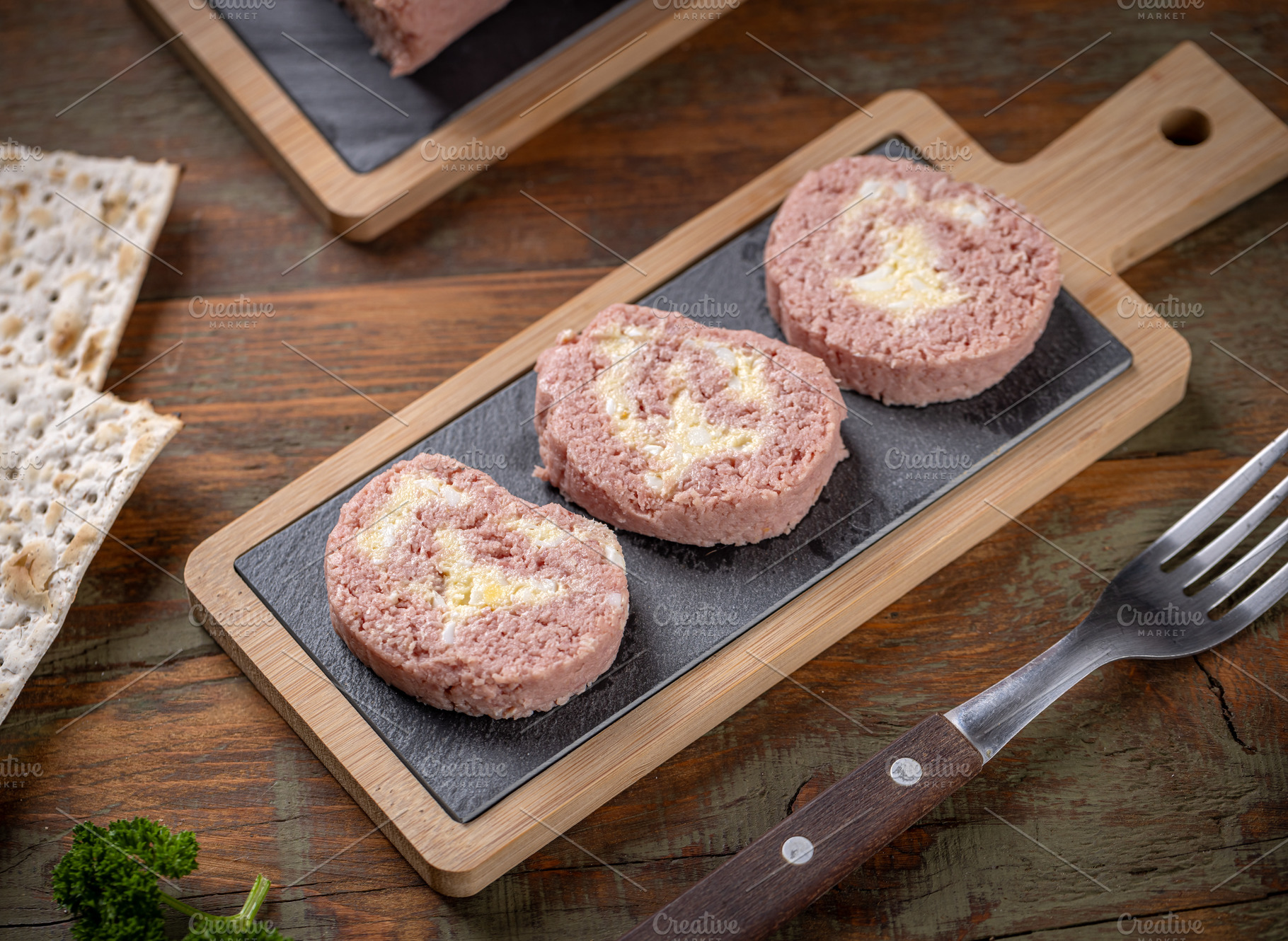 Slices of savory meatloaf with egg filling, a Photo by Grafvision photography