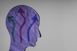 Human head with arrows showing stress, anxiety, confusion, a Photo by salmon.black