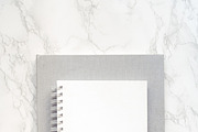 Notepad mockup on the marble desk, a Print Template by Una Matison (Thumbnail 2 of 3)