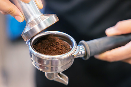 Barista Use Tamper to Press Coffee