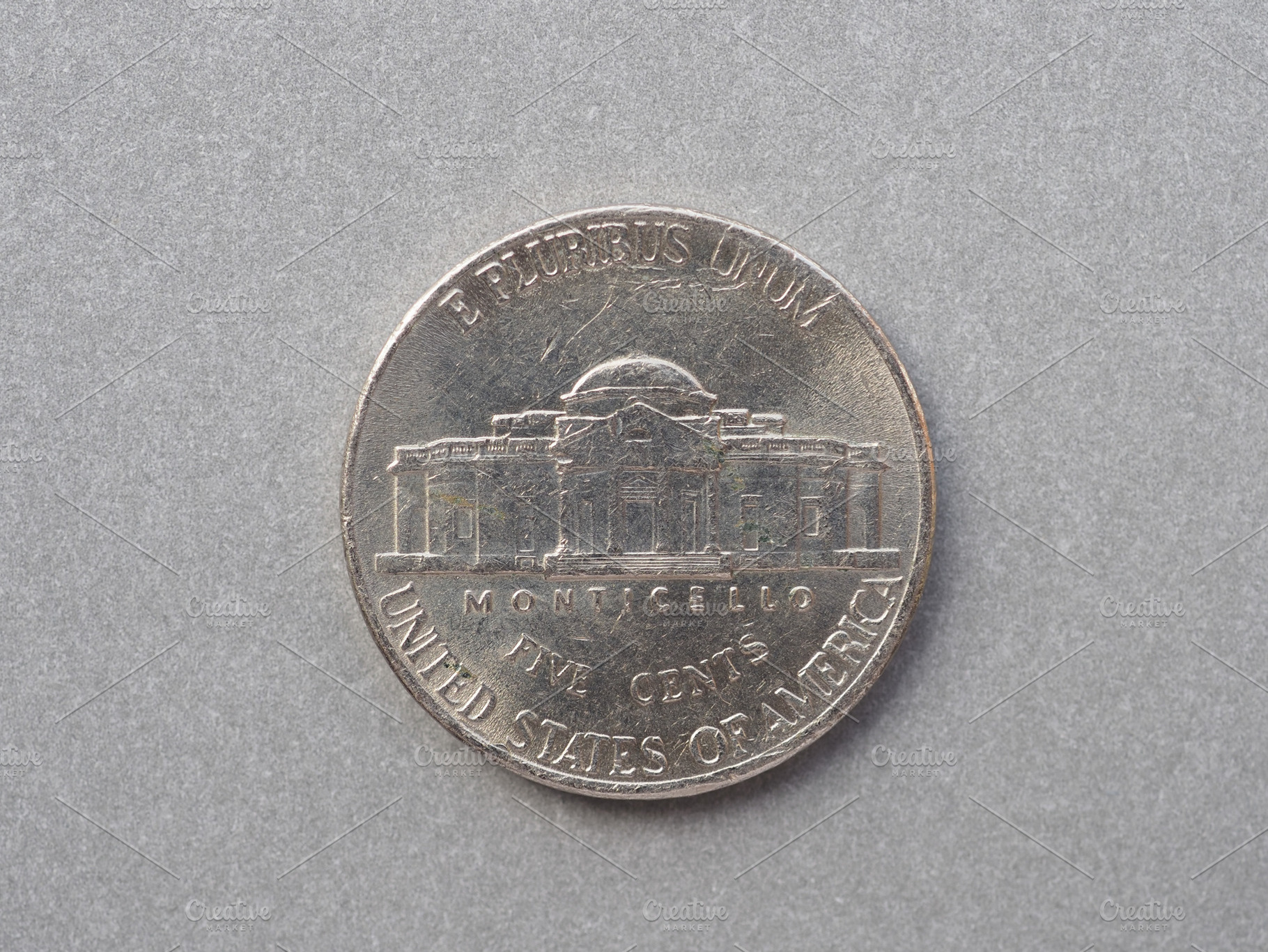 5 cent coin reverse showing Monticello, currency of the USA, a Photo by WorldOfPhotos