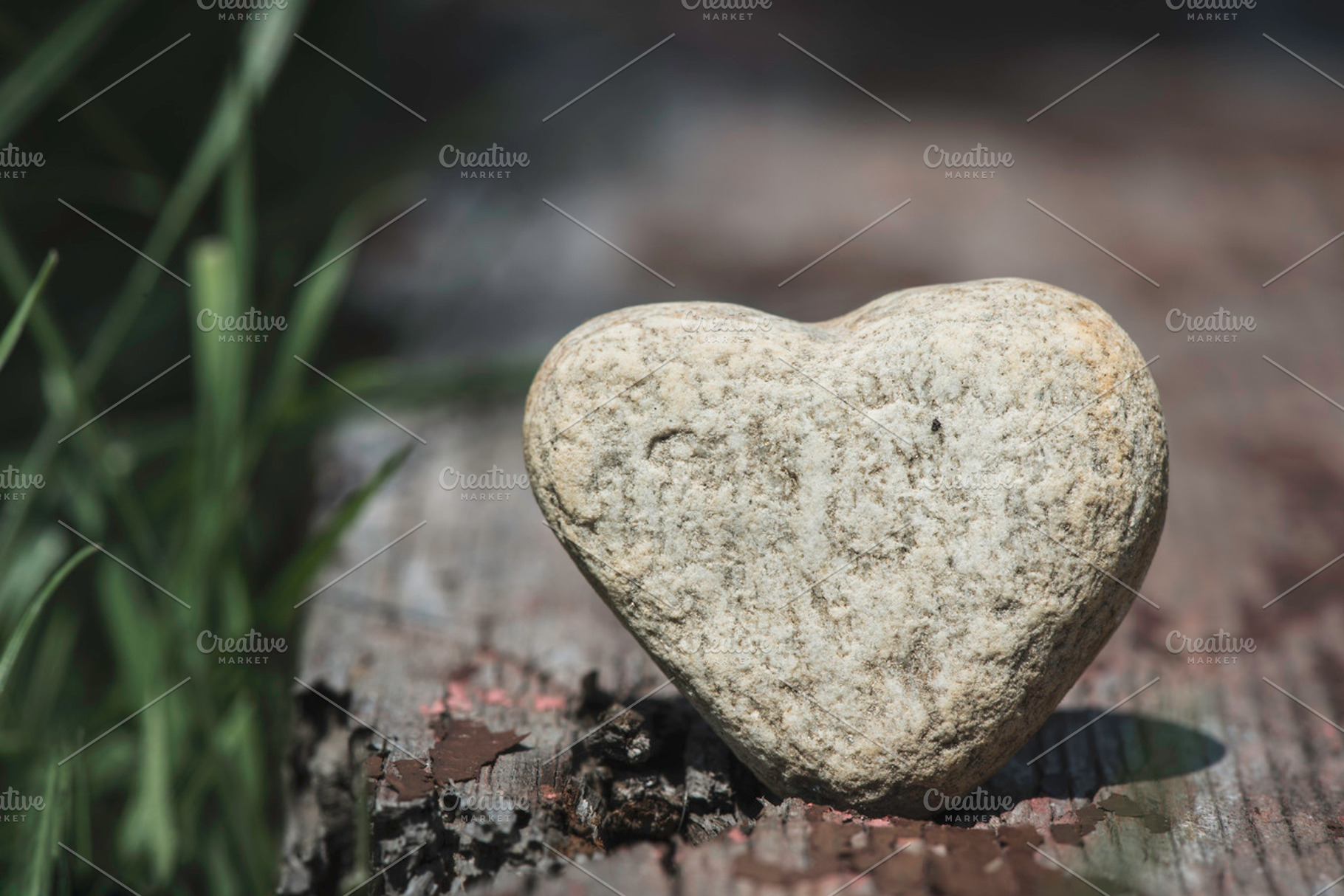 Stone heart shape on wood stock photo containing heart and stone, a Nature Photo by Deyan Georgiev