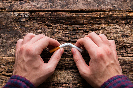 man breaks cigarette, a Health & Medical Photo by itakdalee