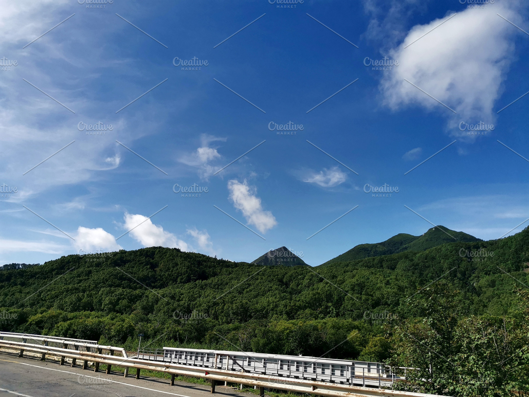 Green mountains under clear sky, a Nature Photo by Elena Vagengeim
