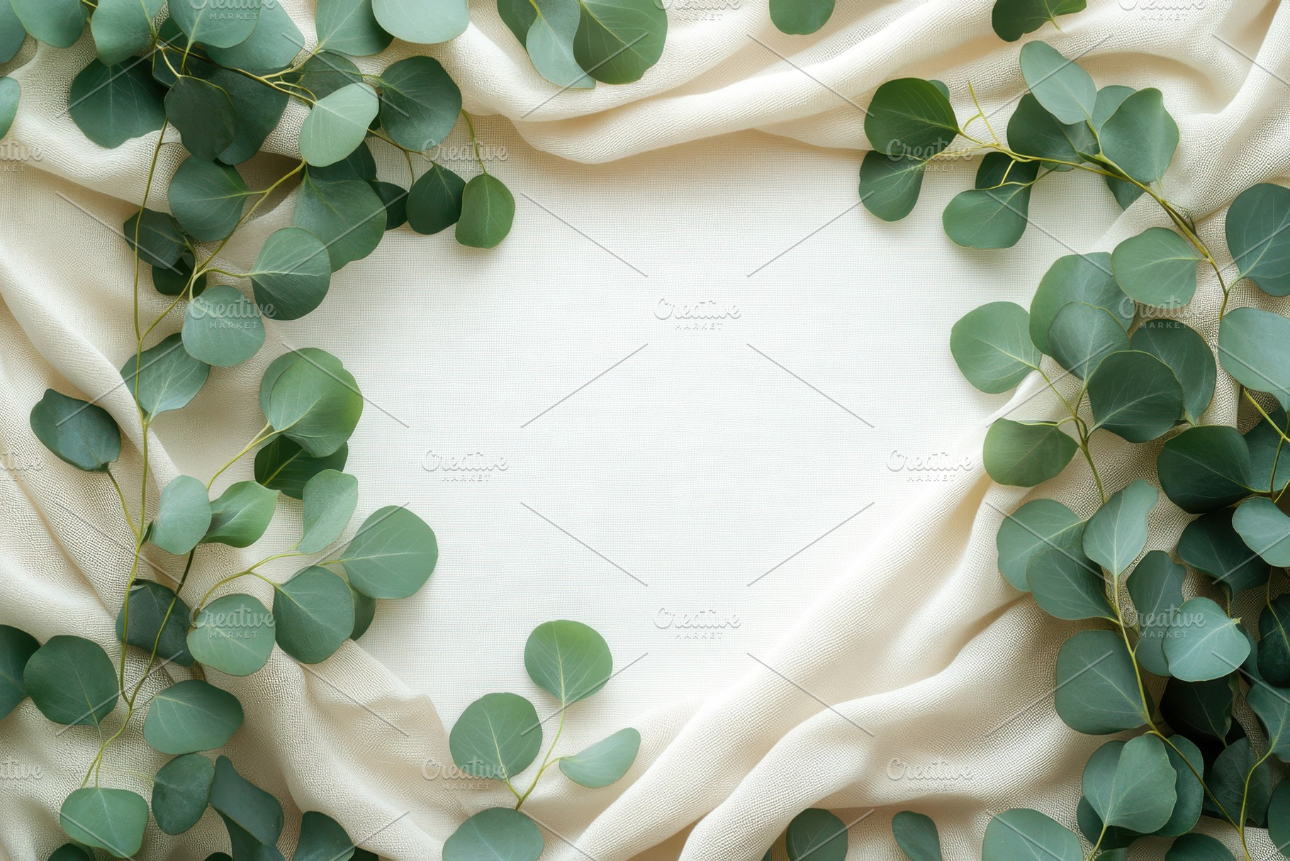 Eucalyptus leaves frame on beige fab, a Background Photo by Pixeness Studio