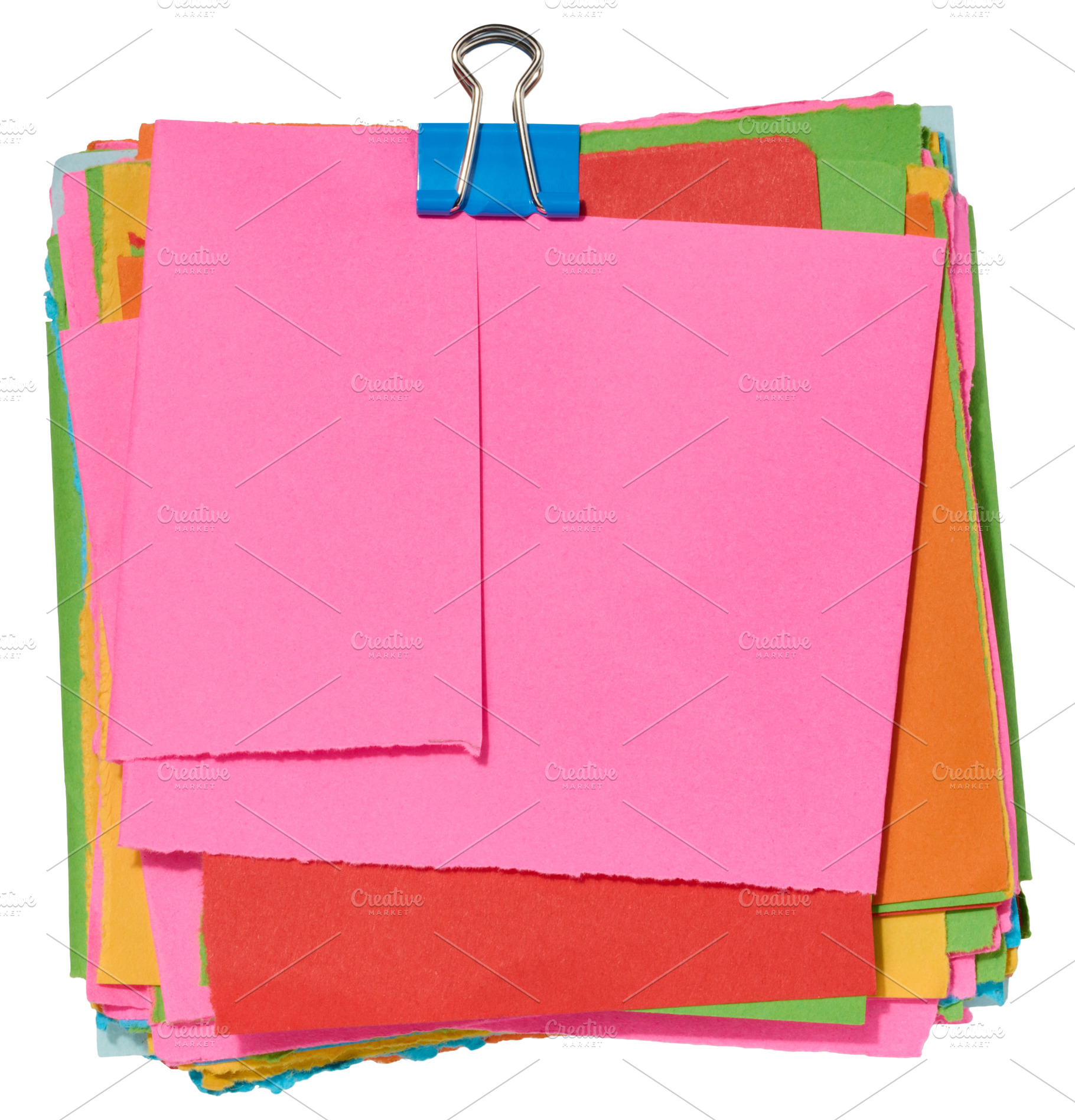 Stack of colorful square sticky notes with jagged edges, secured, a Business Photo by ndanko