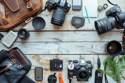 A variety of cameras, lenses, and te, a Photo by Tanuart