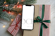 Christmas Phone Mockup Striped Gift, a Product Mockup by TatiMockup (Thumbnail 1 of 5)
