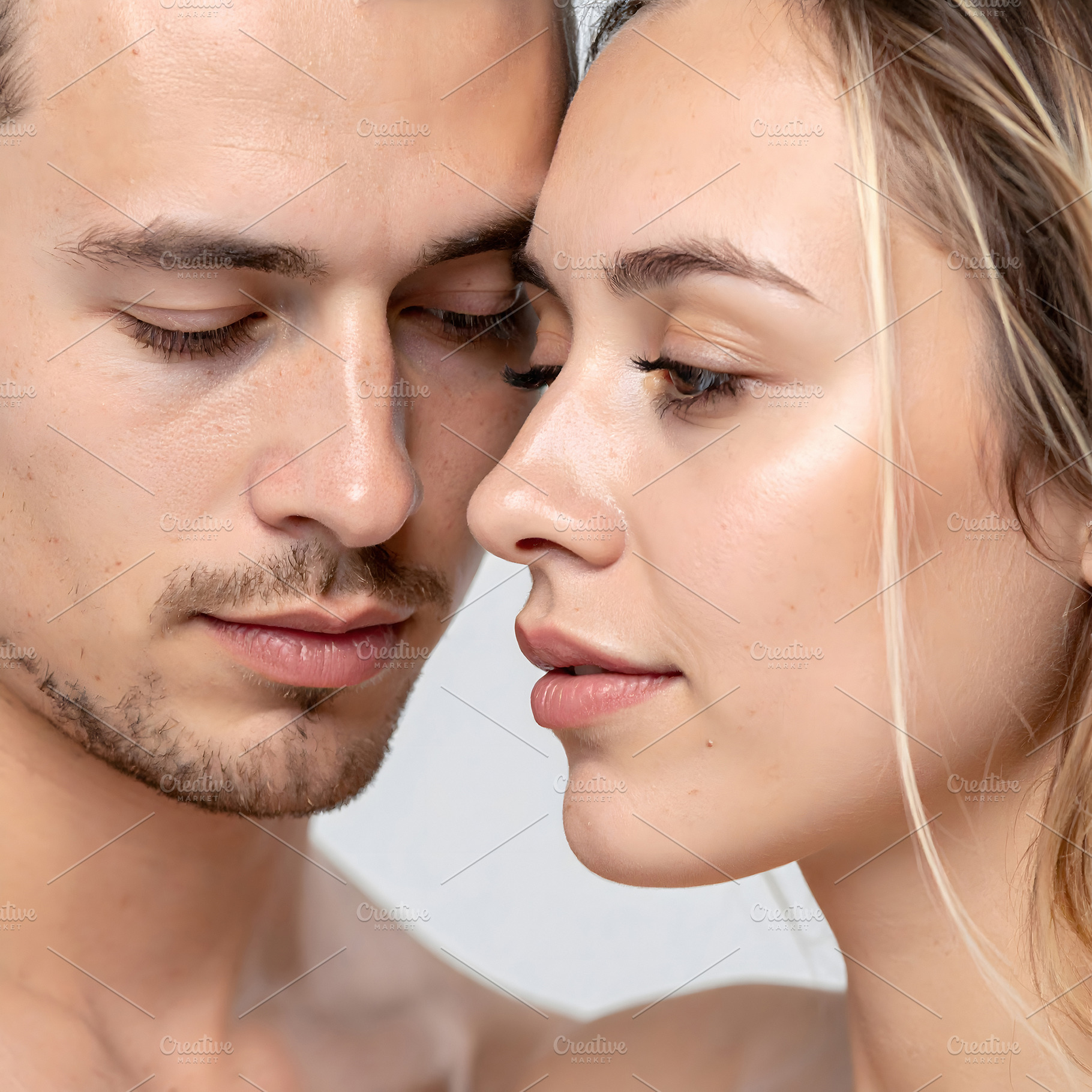 Young couple portrait with close gaze and tender expression, a Person Photo by GoodGoods
