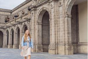 Young woman tourist standing near, an Architecture Photo by Elizaveta Galitskaya