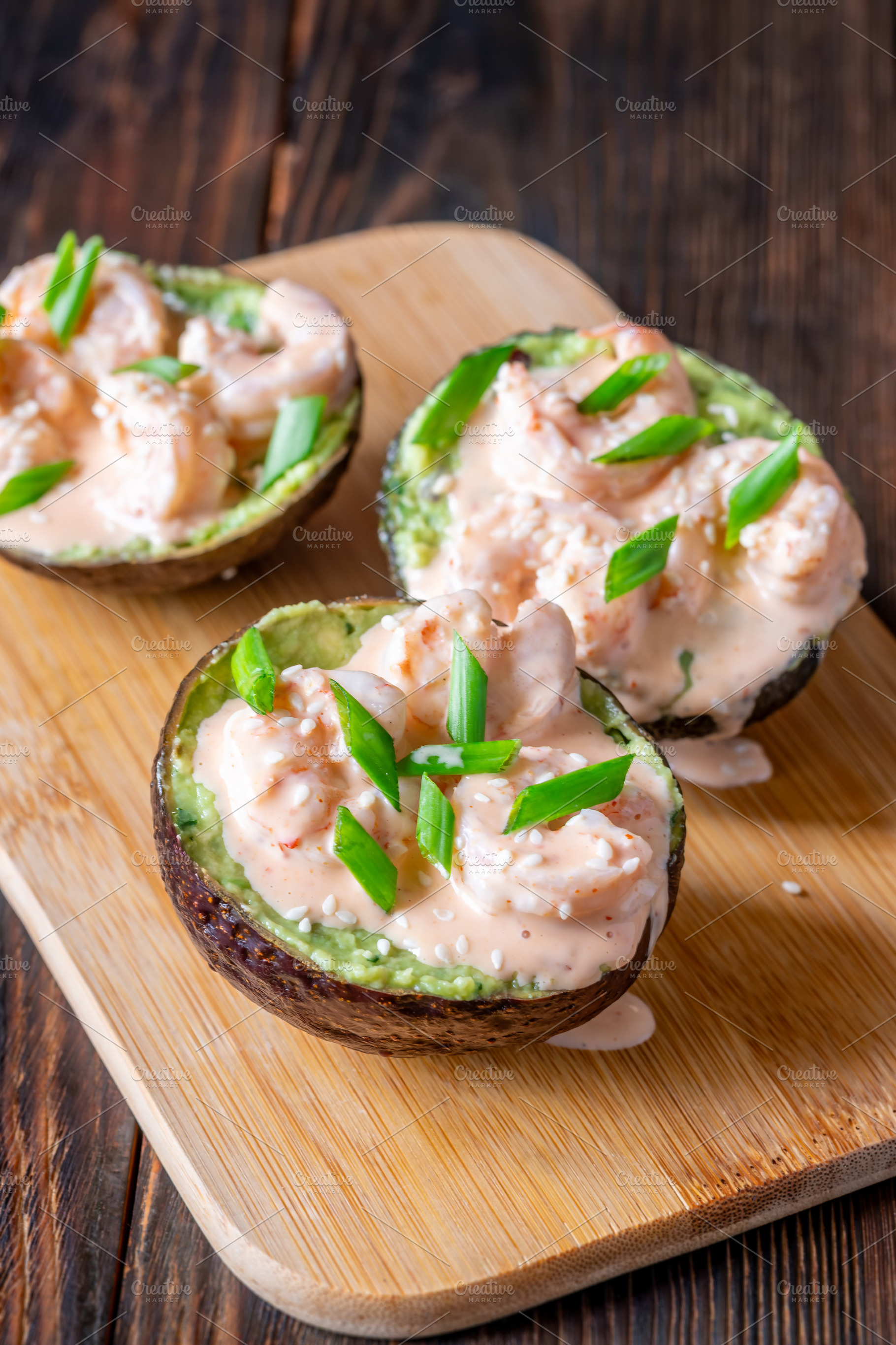 Avocado halves filled with guacamole, a Food & Drink Photo by Alexander Prokopenko