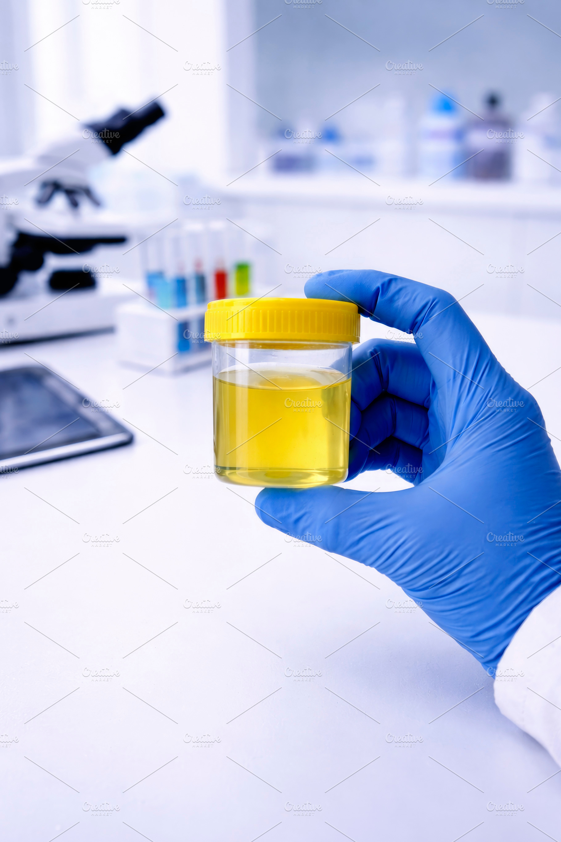 in a lab a man holds a urine sample, generative AI, a Photo by Nito