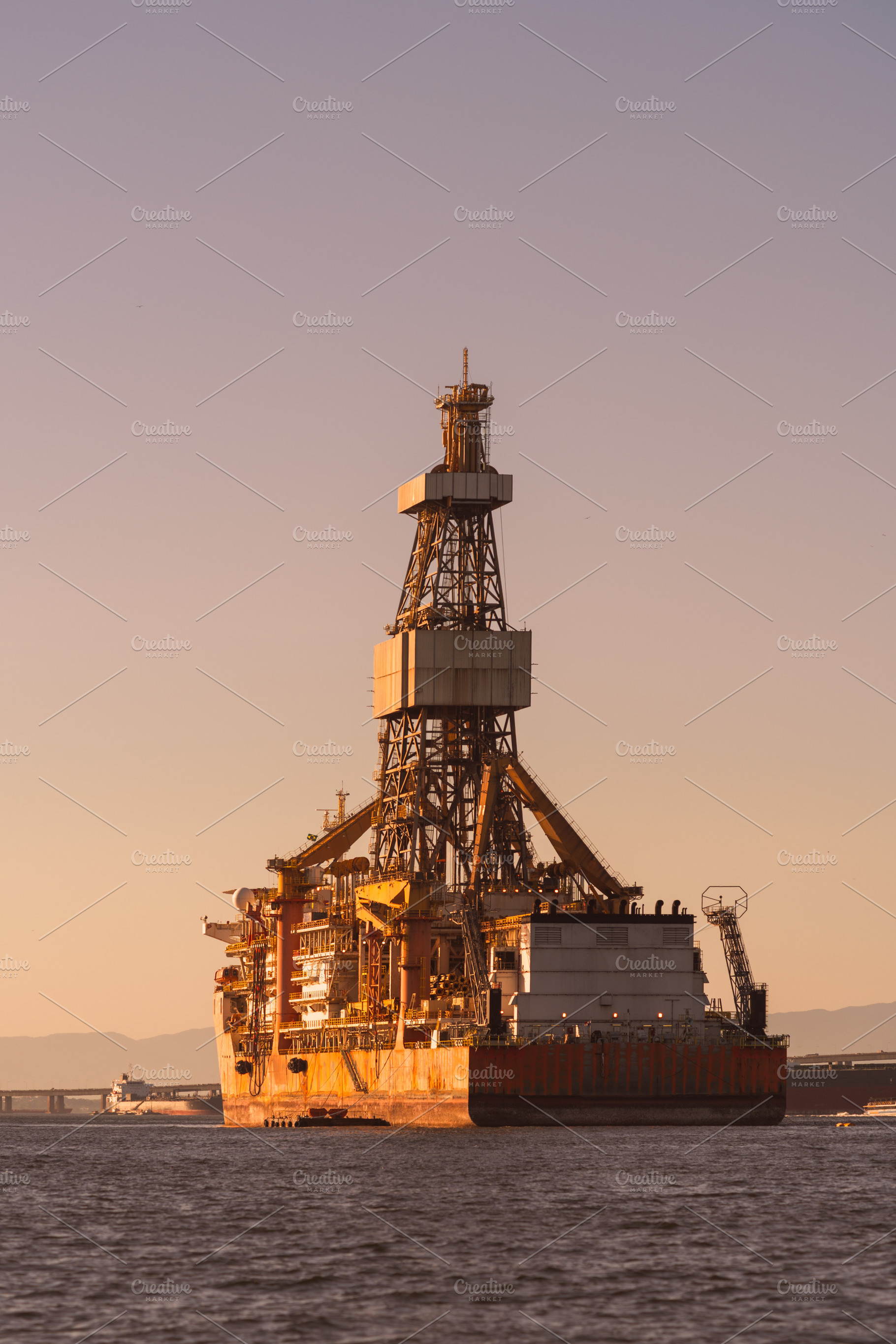 Offshore oil rig at sunset, an Industrial Photo by SkyNext