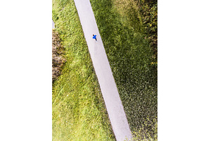 Aerial view of a runner running, a Nature Photo by HalfPoint