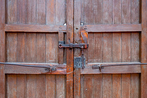 Wooden door close-up view with rusty, an Abstract Photo by GoodGoods
