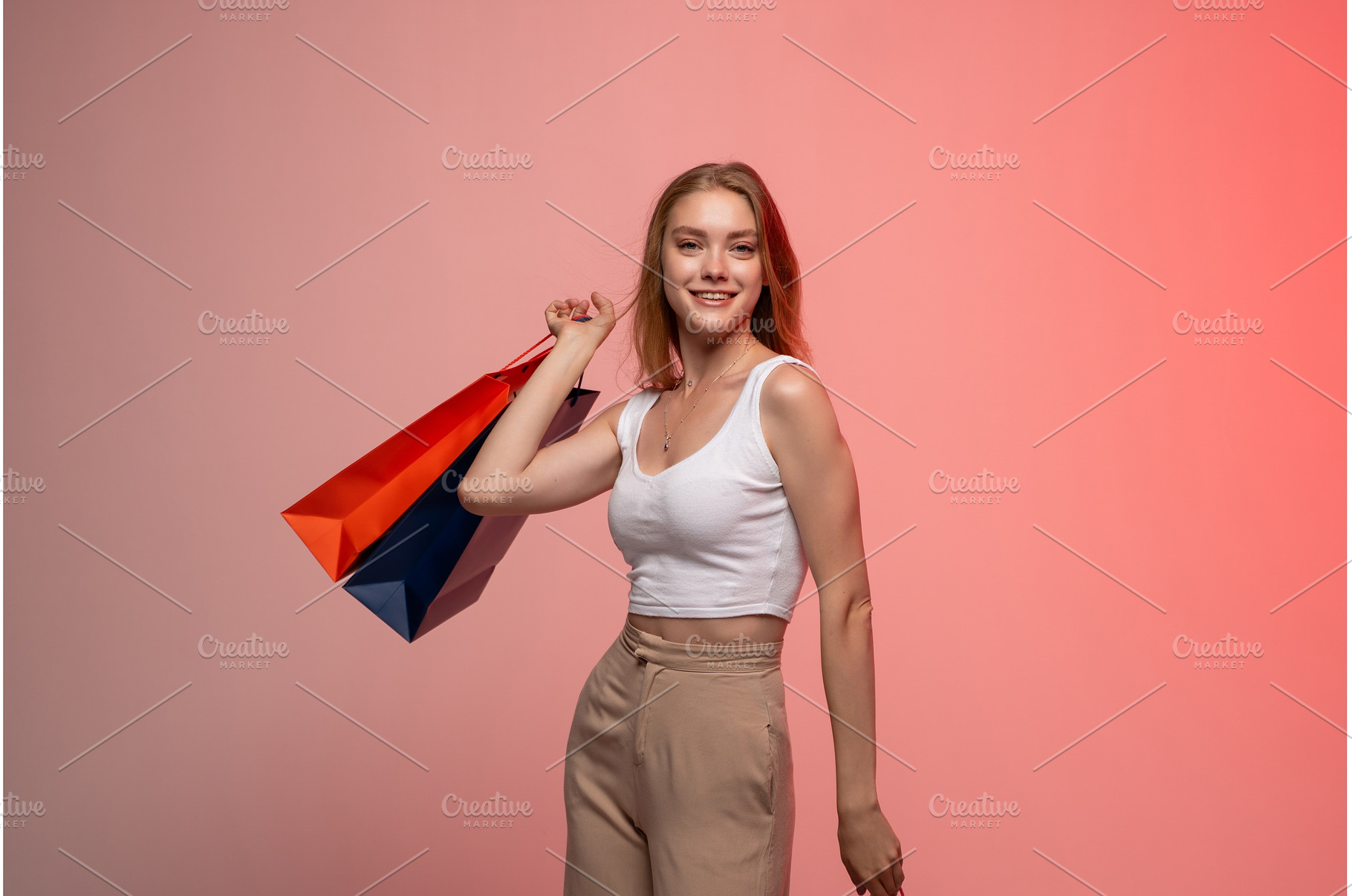Young woman smiling, carrying, a Person Photo by volodymyrshtun13795