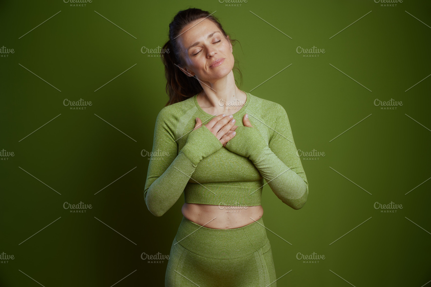 Green Calm: Woman in Meditation, a Person Photo by Alliance Images