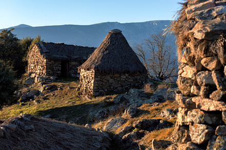 Stone houses with thatched roofs in, an Architecture Photo by Perpis