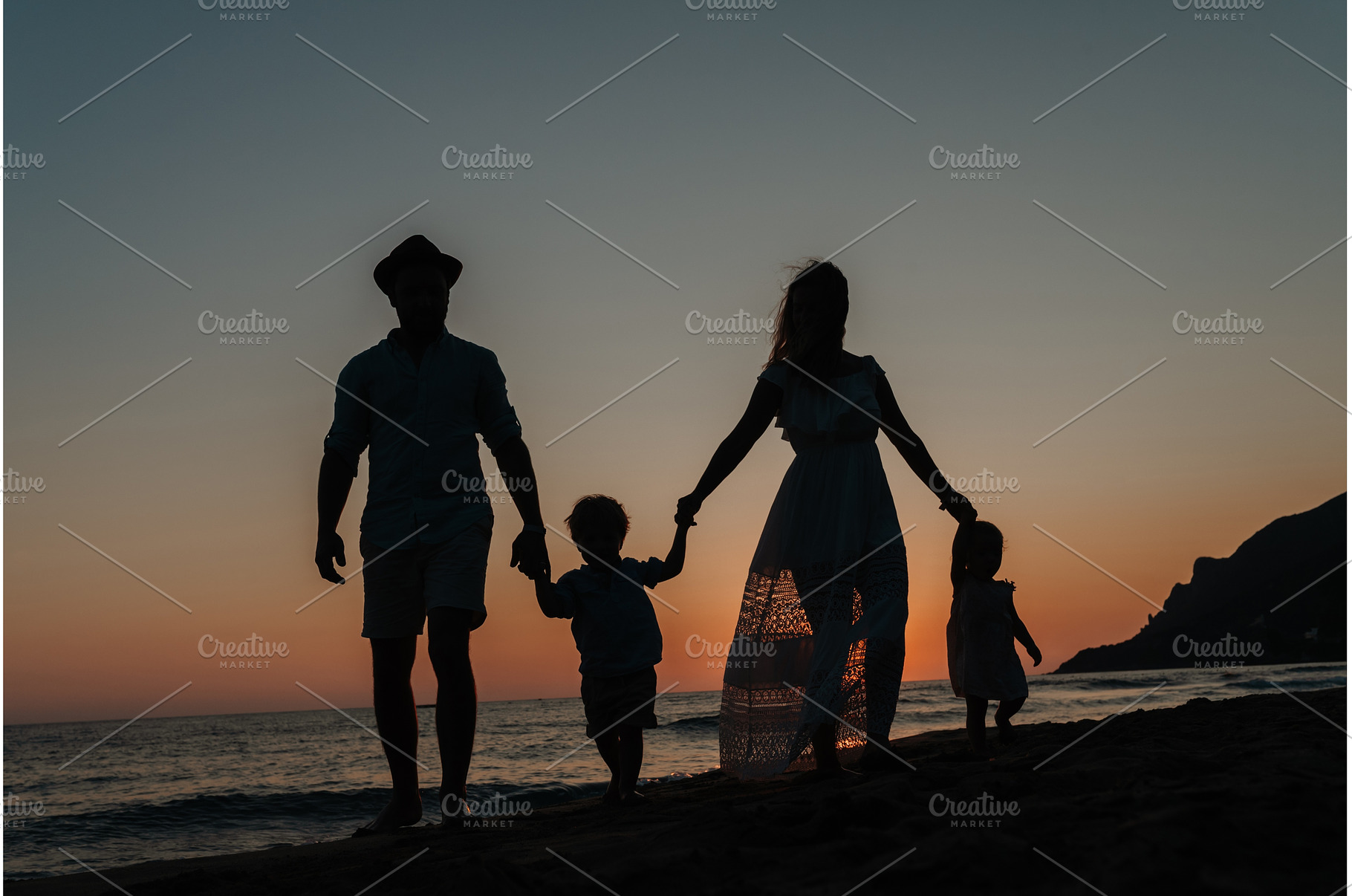 Parents with small children enjoying, a Person Photo by HalfPoint