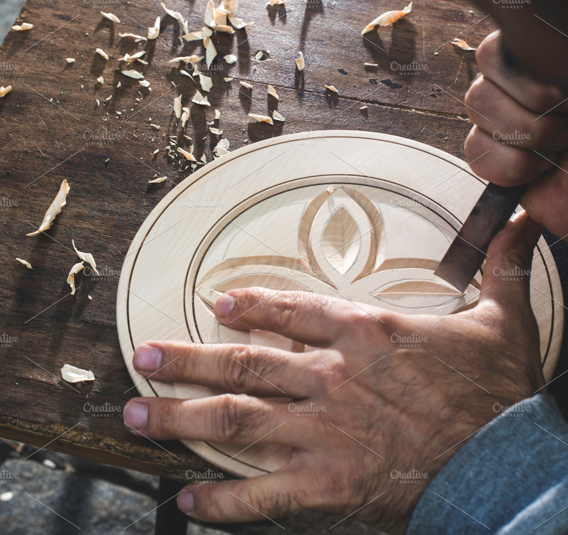 Hands of woodcarver make ​​wooden bo containing wood, woodcarving, and craft, an Arts & Entertainment Photo by Deyan Georgiev